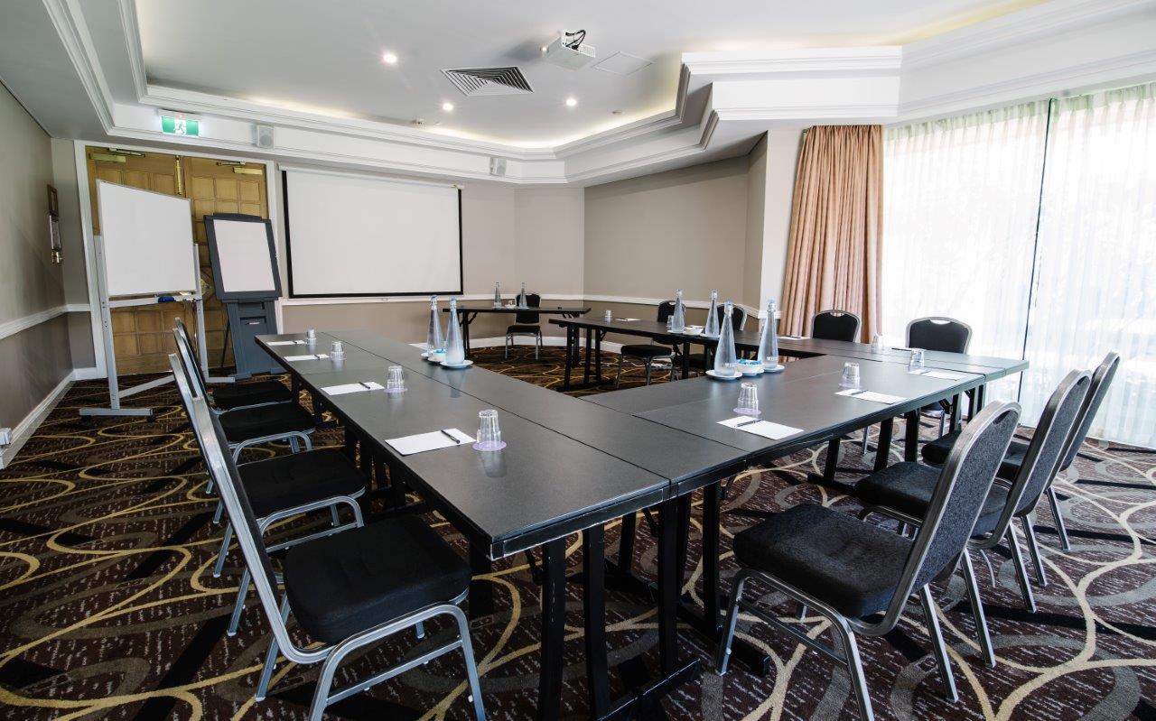 The boardroom with tables and chairs set up